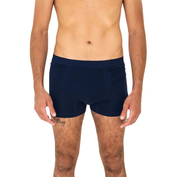 man wearing ink blue terrera boxer briefs mid seaction front view set on a white background