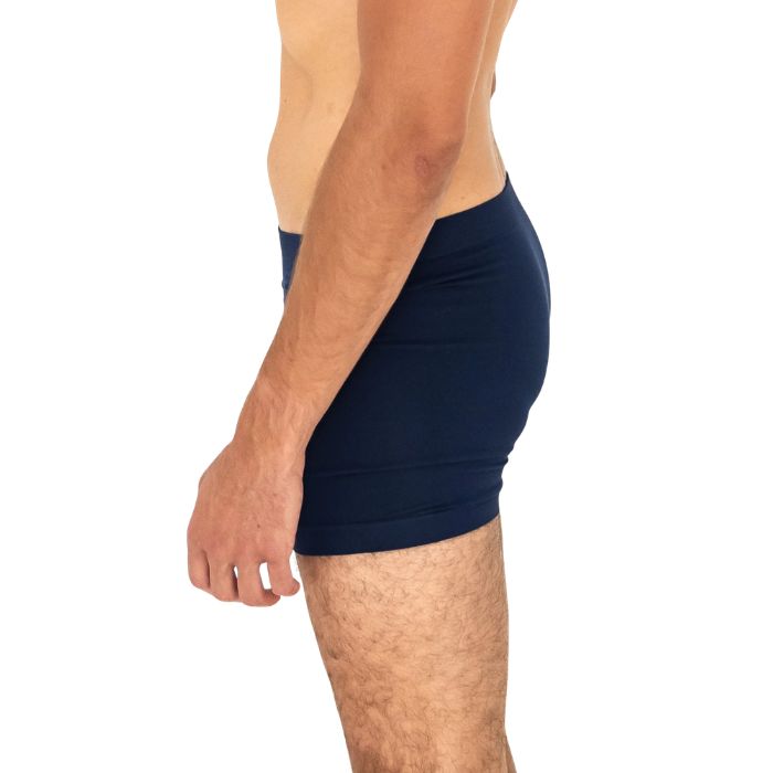 man wearing ink blue terrera boxer briefs mid seaction side view set on a white background