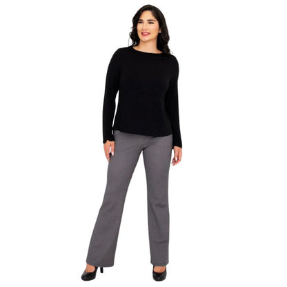 female model wearing mona black long sleeve top and daya pants front view on white background