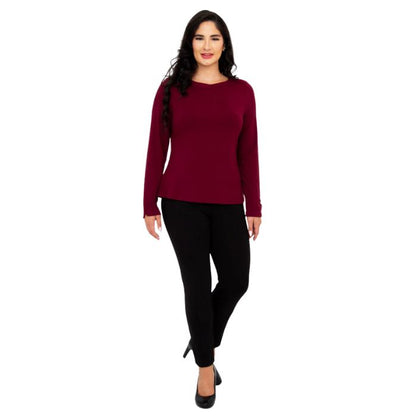female model wearing mona burgundy red long sleeve top and nadia black pants front view on white background