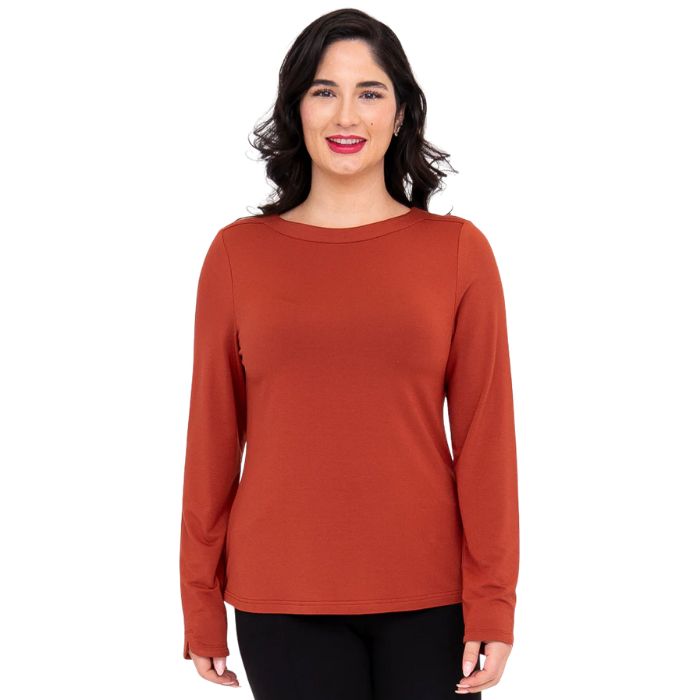 top of female model wearing mona cuprum orange long sleeve top front view on white background