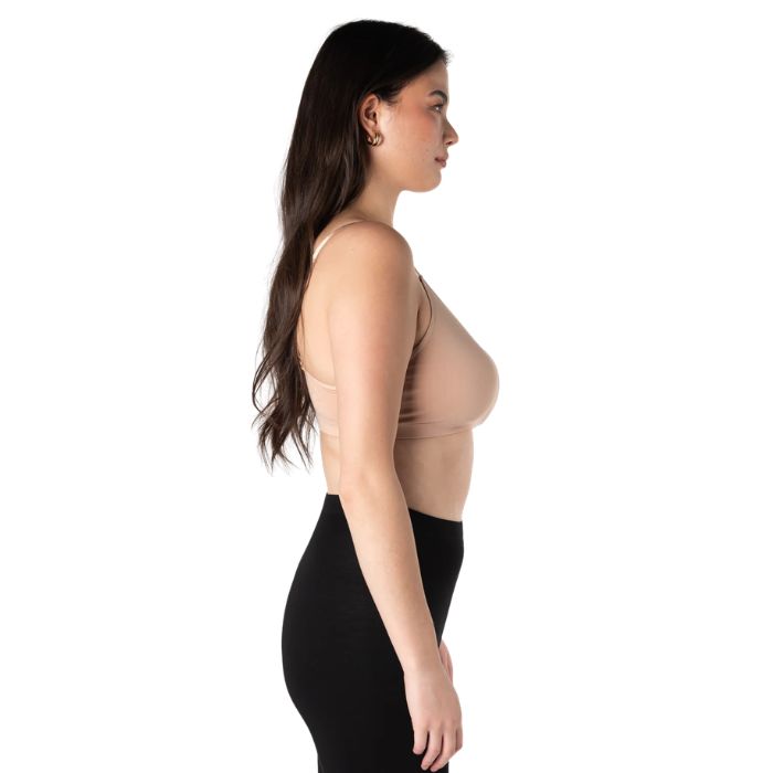 female model wearing beige brown seamless adjustable bralette side view on white background