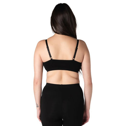 female model wearing black seamless adjustable bralette back view on white background