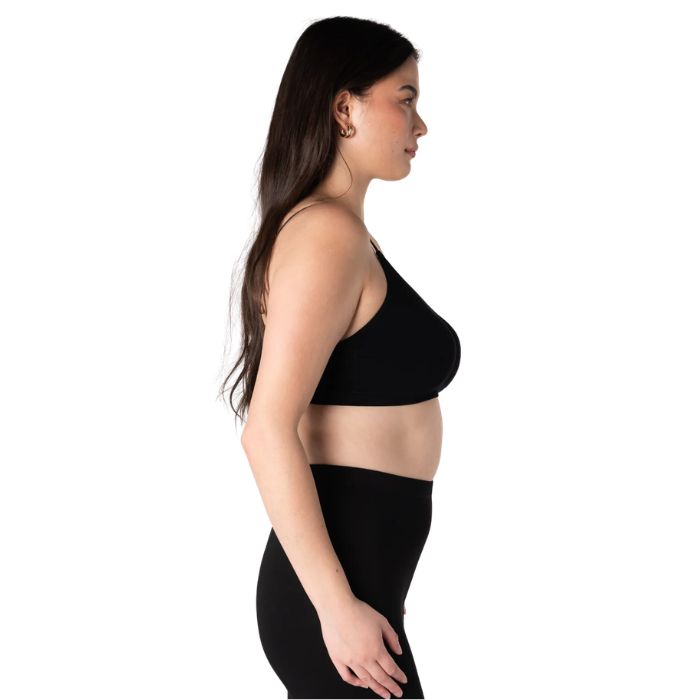 female model wearing black seamless adjustable bralette side view on white background