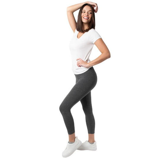 female model wearing charcoal grey suri capro leggings and white brenda tee side view on white background