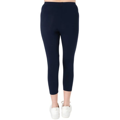 female model wearing ink blue suri capri length leggings back view on white background 