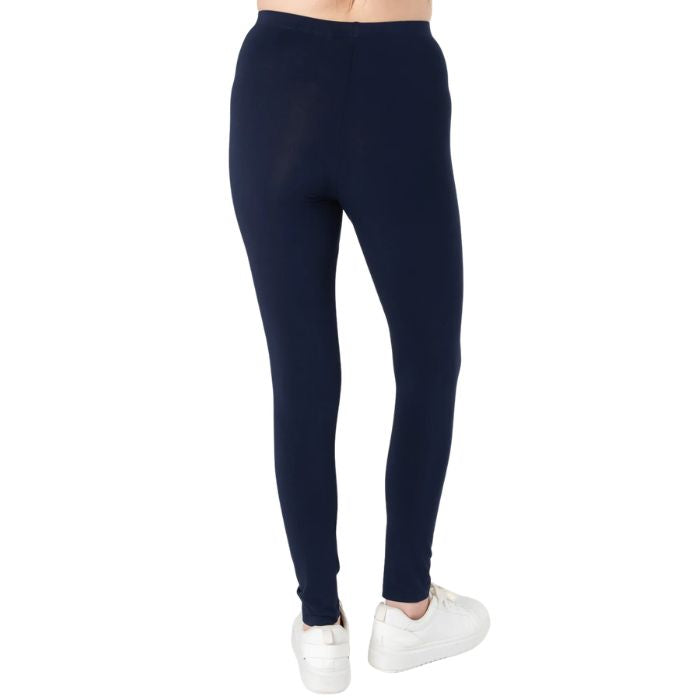 female model wearing ink blue suri full length leggings back view on white background 
