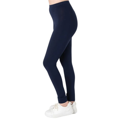female model wearing ink blue suri full length leggings side view on white background 