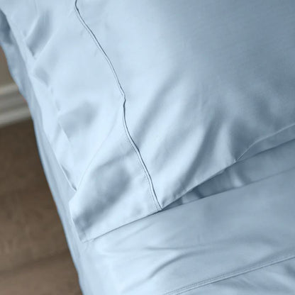 sky blue terrera bamboo pillowcase on a pillow on a made bed