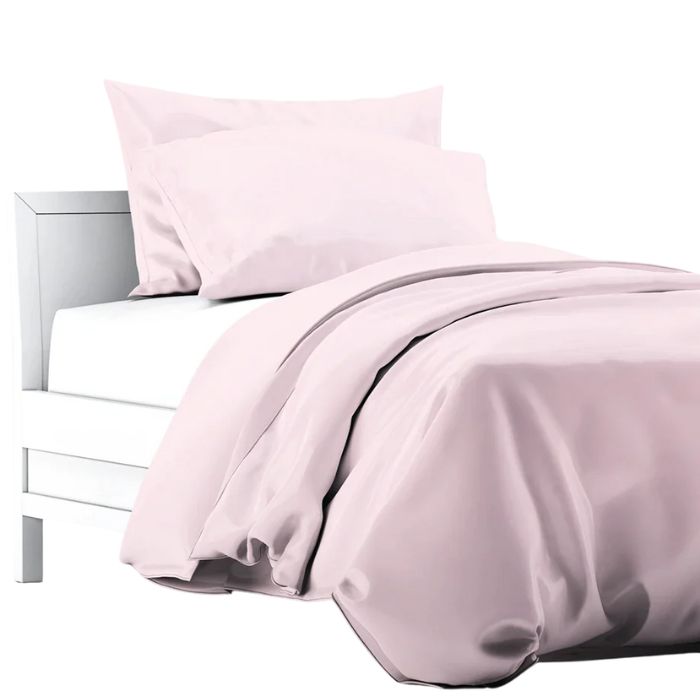 pale rose pink terrera duvet cover and two pillowcases on a bed