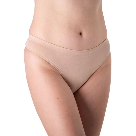 female model wearing beige thong underwear front view on white background
